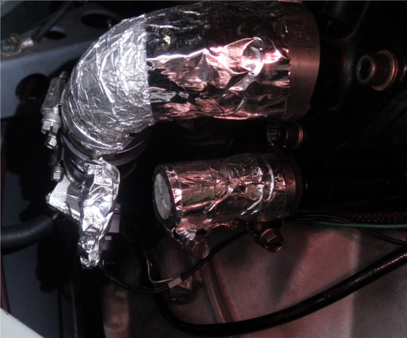 Picture of the engine coolant pipe near thermostat housing
