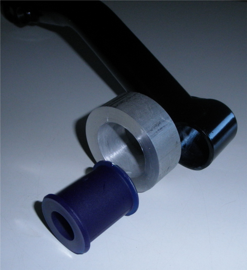 Photo of the arm and bushing and bushing tool 